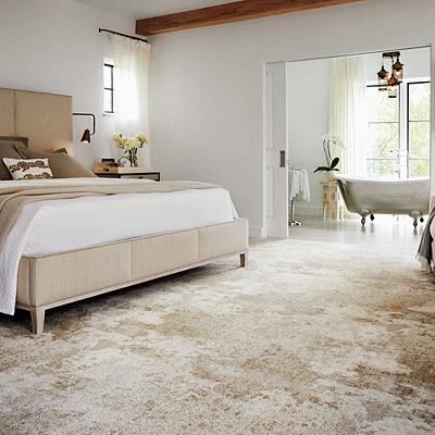 patterned tan carpet in bedroom
