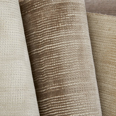 rolls of grey and tan carpet tencel and viscose