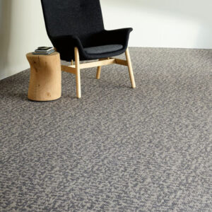 grey specked commercial carpet with black chair